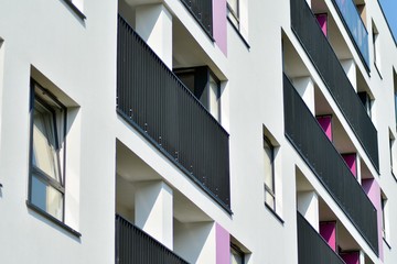 European modern residential architecture. Fragment of a modern apartment building in front. Very modern apartment house. 