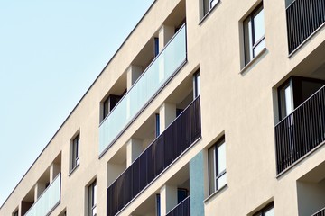 European modern residential architecture. Fragment of a modern apartment building in front. Very modern apartment house. 