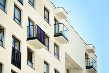 European modern residential architecture. Fragment of a modern apartment building in front. Very modern apartment house. 