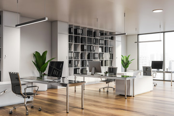 Modern white office interior with furniture.