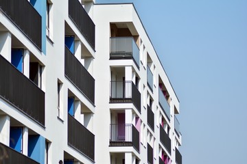 European modern residential architecture. Fragment of a modern apartment building in front. Very modern apartment house. 
