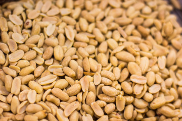 brushed peanut nuts food background on supermarket counter for selling 