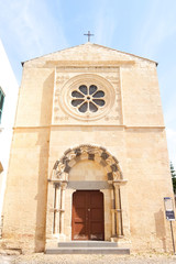 Tarquinia, Italy. Sunny day in Tarquinia. Beautiful view of catholic church (Chiesa dell'Annunziata). XII century.