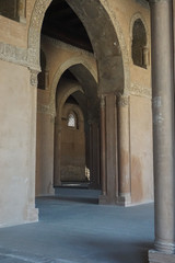 Fototapeta na wymiar Cairo, Egypt: Arches of the Mosque of Ibn Tulun (879 AD) -- the oldest in Cairo surviving in its original form and the largest in land area.