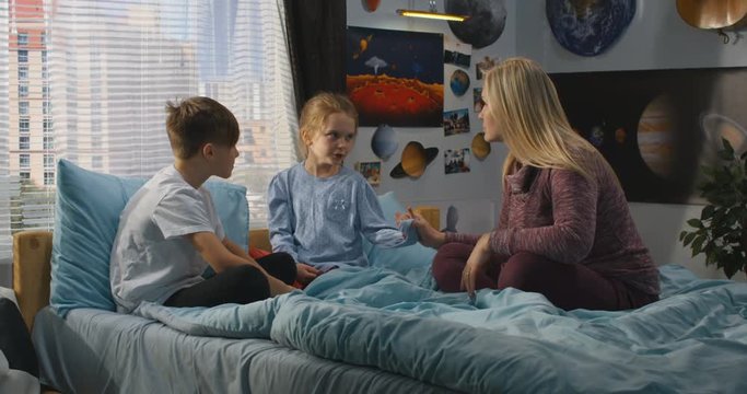 Mother talking with bickering siblings