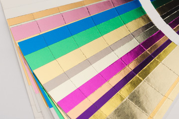 multicolor hotfoil paper sampler isolated on white