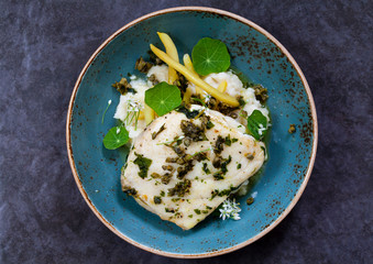 Butter poached halibut with french beans, celeriac mash and caper sauce 