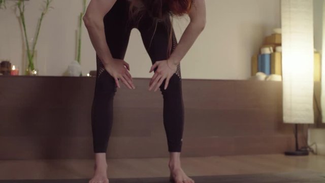 Woman doing kriya yoga - nauli, cleaning exercise