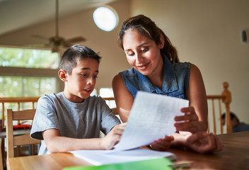 mother helping son with homework