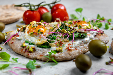 Quail eggs on pita bread