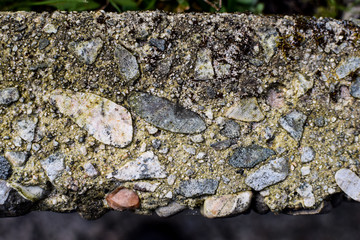 The texture of the concrete stone curb. View from above.