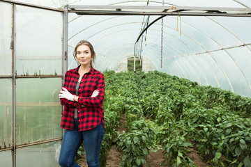 Outdoor portrait of young female farmer