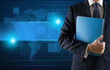 Portrait of happy businessman on background