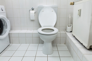 White Toilet Bowl In Bathroom
