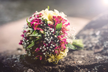 rustic wedding vessel, flower arrangement for wedding. Wedding dress.