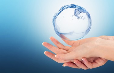 Water figure with human hand isolated