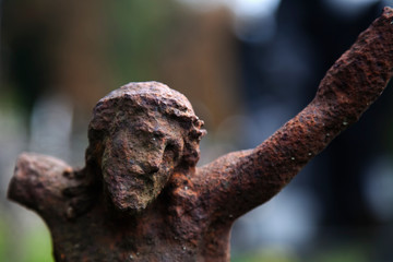 Partially destroyed ancient statue of the crucifixion of Jesus Christ (Faith, religion, suffering, love, God concept)