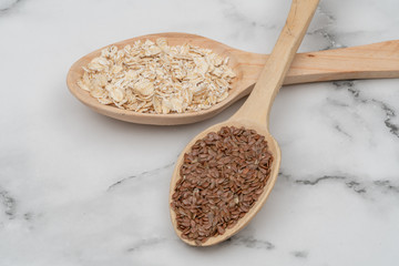 Seeds on a wooden spoon close up