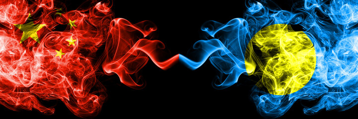 China vs Palau, Palaulan smoke flags placed side by side. Thick colored silky smoke flags of Chinese and Palau, Palaulan