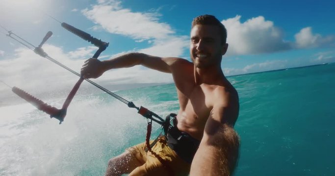 Kitesurfer riding with the wind