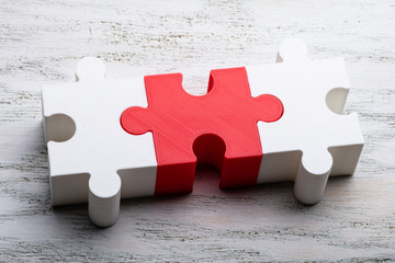 Jigsaw Puzzle Block On White Textured Background