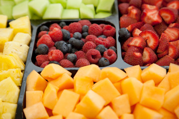 Tray of cut melons and berries 
