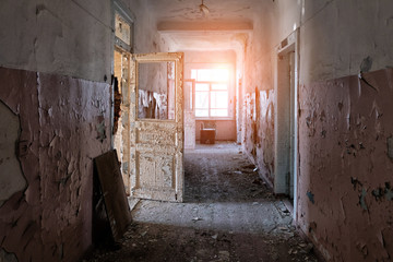 Fototapeta na wymiar Corridor of old abandoned hospital