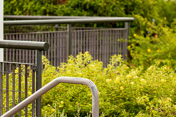 stairway railing with plants and bushes. in silver - Powered by Adobe