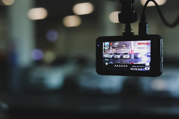 video camera recorder inside vehicle in car park