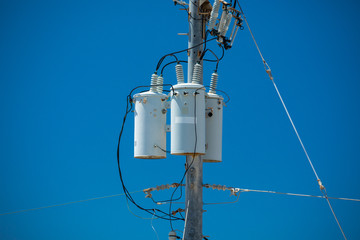 Electric pole with a transformer and wires