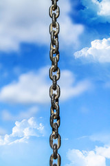 Metal chain against the sky