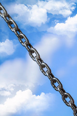Metal chain against the sky
