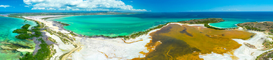 Aerial view of Puerto Rico. Faro Los Morrillos de Cabo Rojo. Playa Sucia beach and Salt lakes in...