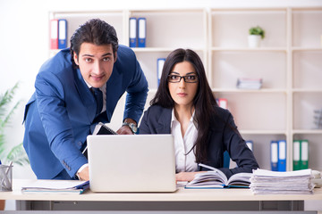 Two employees working in the office 