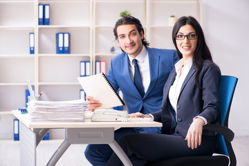 Two employees working in the office 