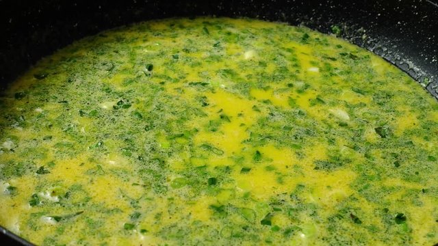 Preparation of omelet on a frying pan. Time lapse.