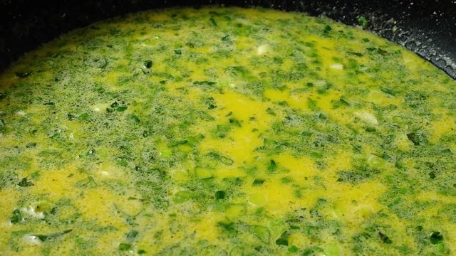 Preparation of omelet on a frying pan. Time lapse.