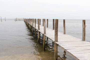 Unfinished wooden pier on the sea