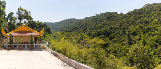 Buddhist temple in a hilly tropical area