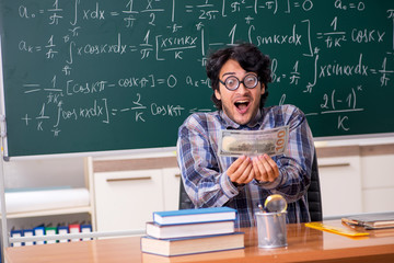 Funny male math teacher in the classroom 