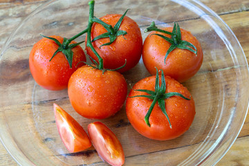 a group tomatoes on wood table background