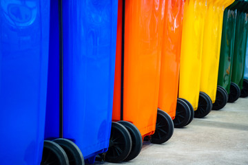 Colorful plastic recycle bins . Environment conservation, cleaning concept.