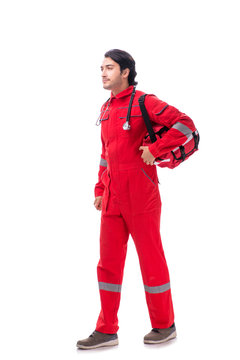 Young paramedic in red uniform isolated on white 