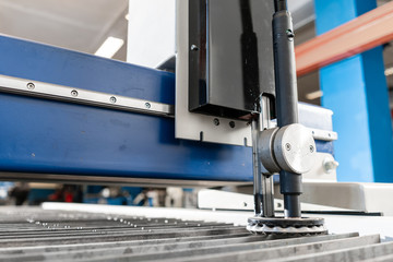 Industrial plasma machine cut of metal plate. New CNC Laser Plasma. Selective focus on laser plasma cutting of metal modern technology.