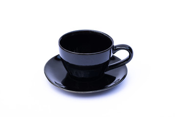 Empty black cup of coffee with plate isolated on white background.