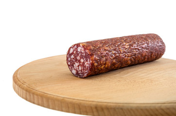 smoked sausage on a wooden board and on a white background