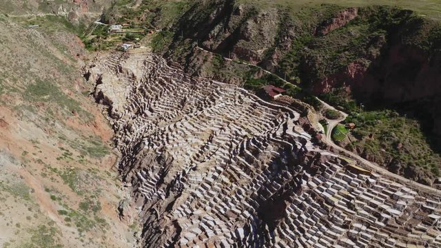 Aerial view of landscape of the salt terraces of Maras (Salineras de Maras) in the Andes mountain range in the region of Cusco, Peru, Sacred Valley (Valle Sagrado) alpine landscape.