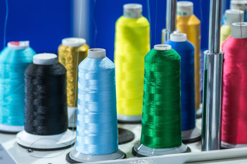 different color threads on the sewing machine