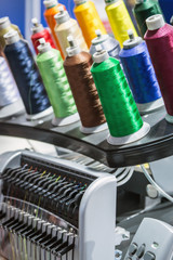 different color threads on the sewing machine