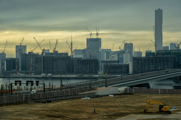 Scene of Building and bridge cityscape under construction in twilight time around Odaiba area, Tokyo, Japan